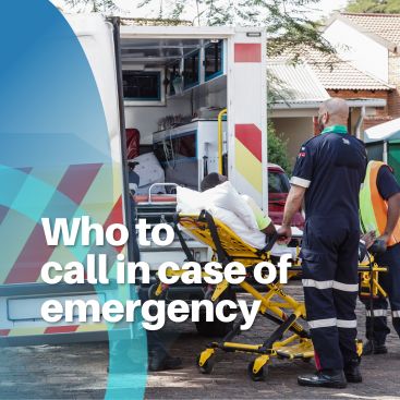 Paramedics loading a patient into an ambulance during an emergency response.