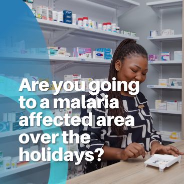 Smiling pharmacist working in a dispensary, preparing medication with chronic medication shelves behind her.