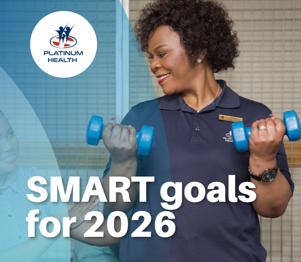Platinum Health staff member exercising with dumbbells to promote SMART health goals for 2026