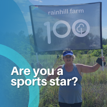 Woman holding Rainhill Farm 100 Club sign asking are you a sports star