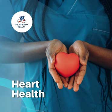 Heart health awareness with healthcare professional holding a red heart – Platinum Health