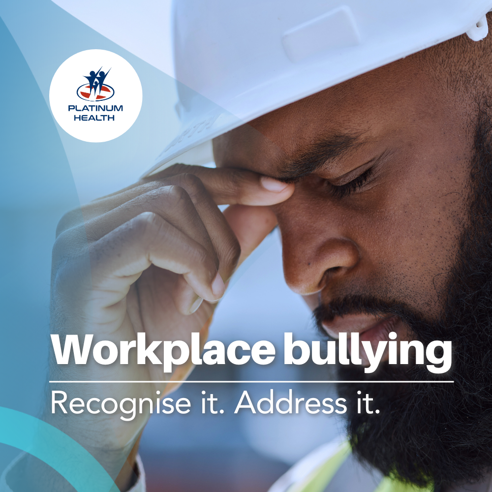 Distressed employee highlighting the effects of workplace bullying in a Platinum Health Employee Assistance Programme awareness article.